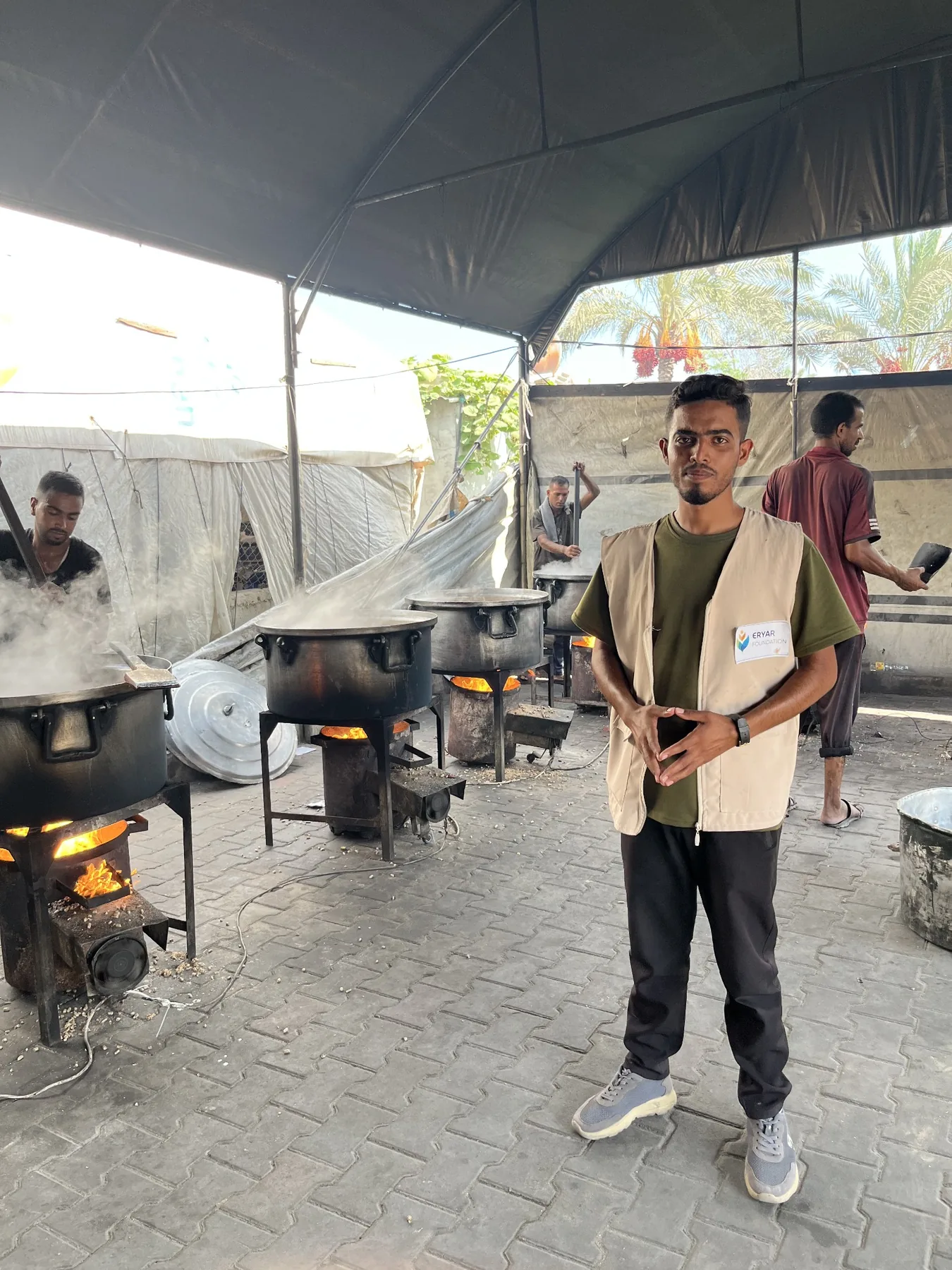 Large cooking pots being used to prepare meals